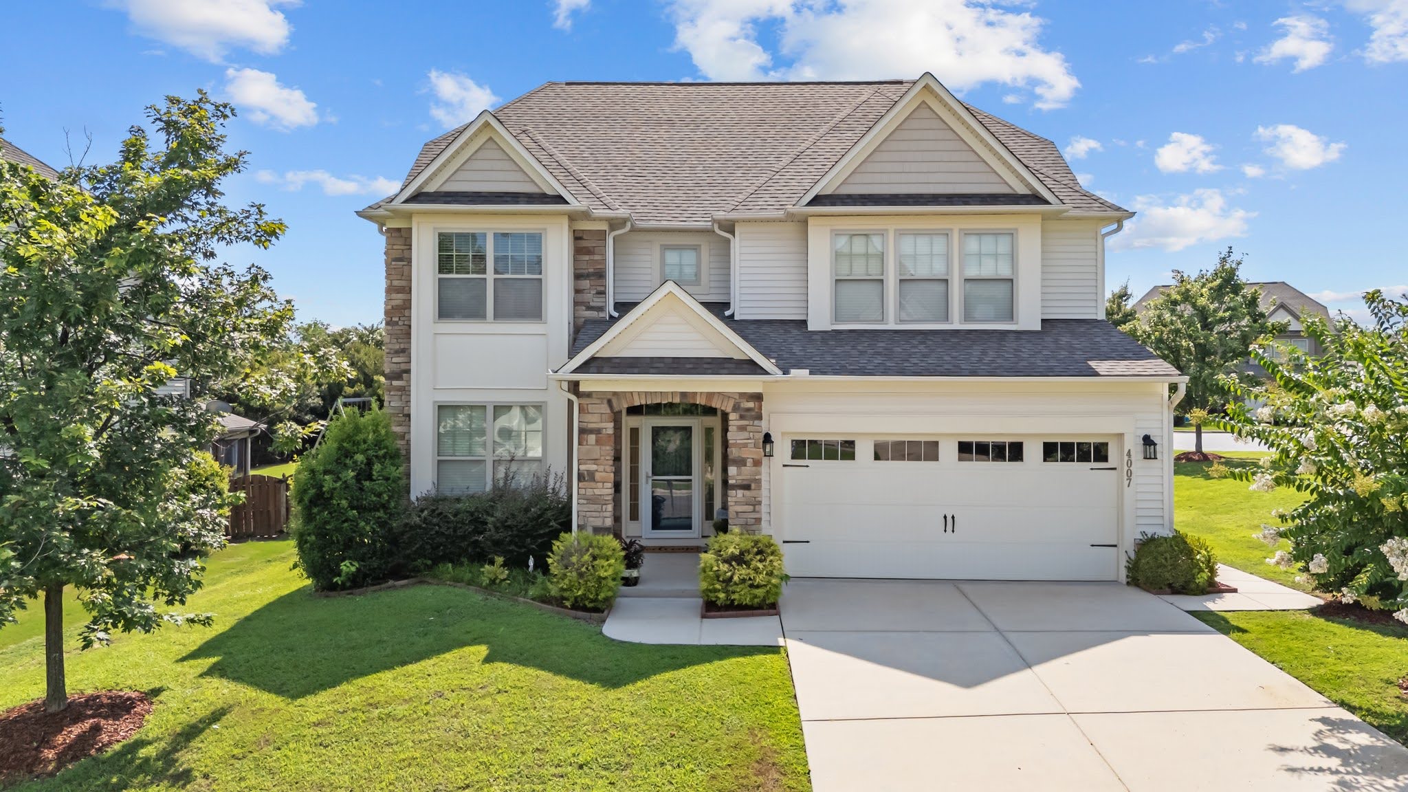 Front Elevation · Stone Facade · Blue Sky