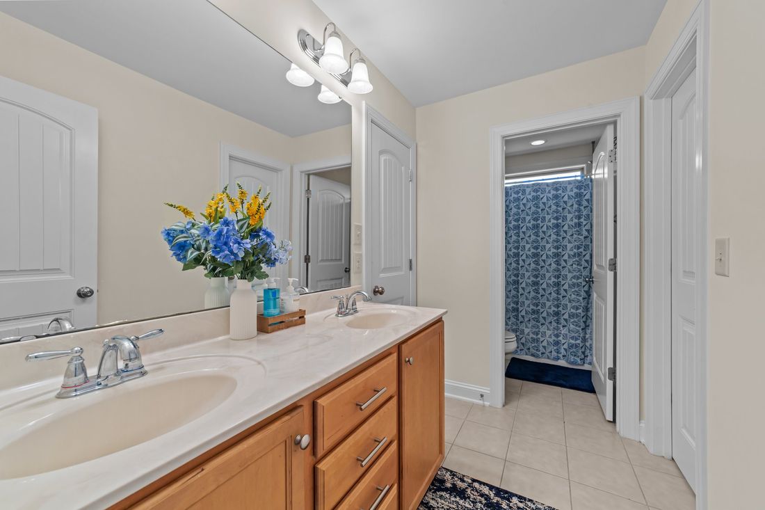 Jack & Jill · Double vanity · Private shower room beyond